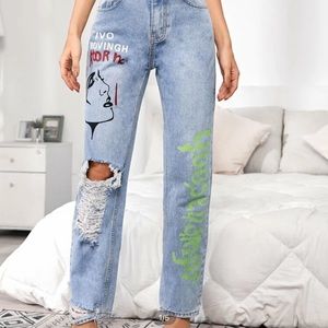 Ripped figured and letter graphic jeans